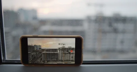 Construction of blocks, buildings in the city, background of a sunset. Stock Footage 127849161