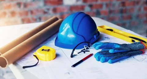 Construction, blueprint and helmet with tools on table for renovation, buil.. Stock Photos