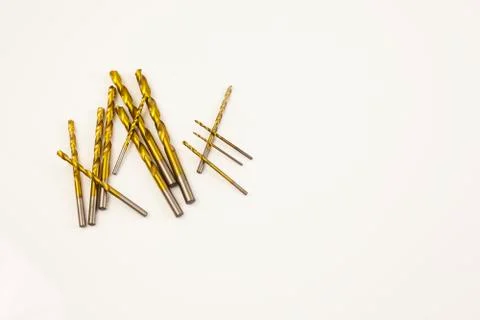 Construction Brass Drills bits on table Stock Photos