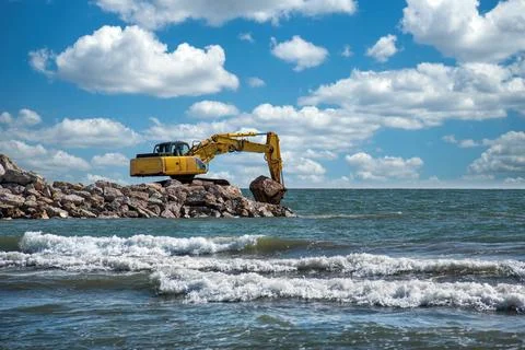 Construction of breakwater cliffs to defend the coastline from storms Stock Photos