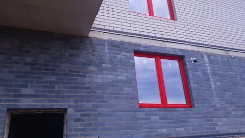 Construction of a brick apartment building. Construction building. Stock Footage 345686213