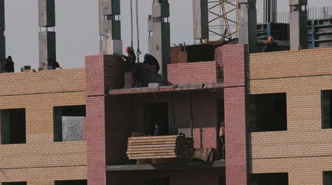 Construction of a brick high-rise building Stock Footage 61908813