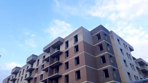 Construction of a brick house. Construction site for modern, affordable housing. Stock Footage 345598494