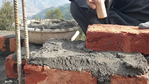 Construction of brick house in rural area Video stock 256773489