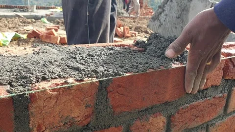 Construction of brick house in rural area Stock-Footage 256773540