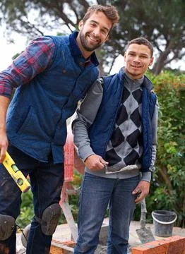 Construction, bricklayer and men building in portrait, handyman or contractor Stock Photos
