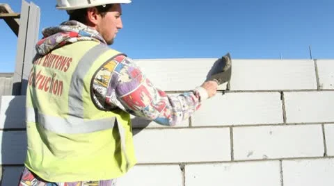 Construction. Bricklayer working on construction site. Video stock 8994929