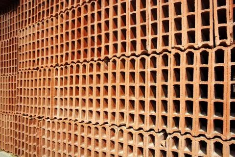 Construction bricks stacked pattern red clay Stockfoto's