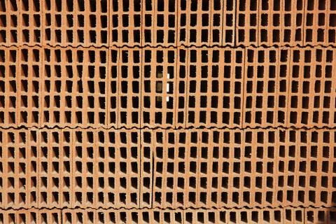 Construction bricks stacked pattern red clay Stock Photos