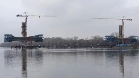 Construction of bridge across Danube Video stock 328003589