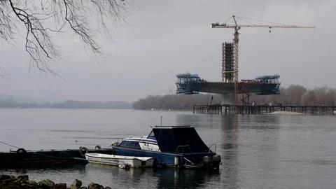 Construction of bridge across Danube Video stock 328003592