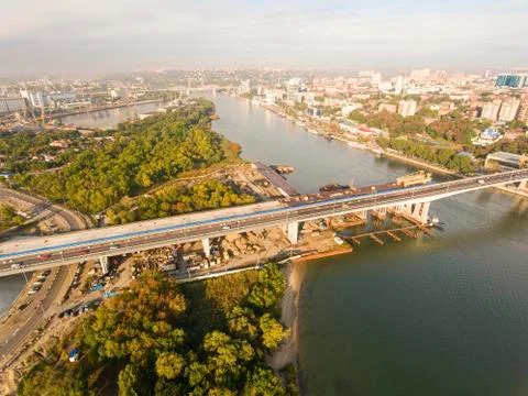 Construction of the bridge across the river. Stock Photos