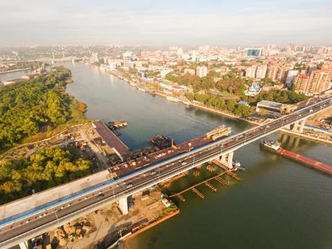 Construction of the bridge across the river. Stock Photos