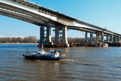 Construction of a bridge across the river. Stock Photos