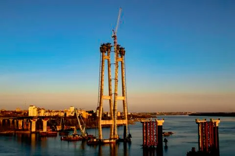 Construction of a bridge across the river Stock Photos