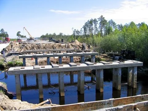 Construction of a bridge across the river Stock Photos