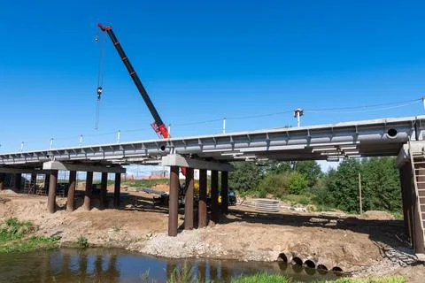 Construction of a bridge on a road section Stock Photos
