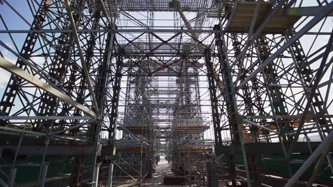 Construction of a bridge with scaffolding. Under construction of metal steel  Stock Footage 149785078