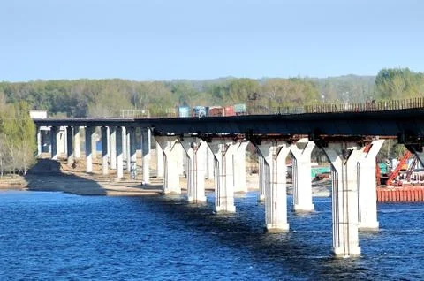 Construction of the bridge through the river Stock Photos