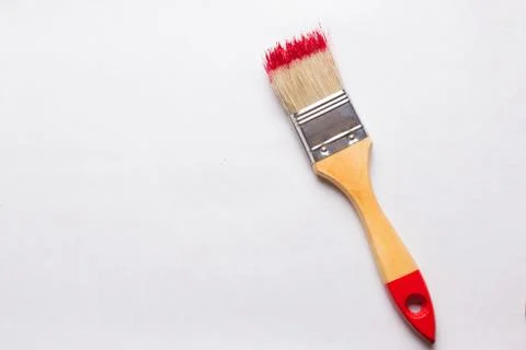 Construction brush with red paint Stock Photos