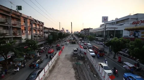 Construction of the BTS public train in center of road car moving in rush hour Stock Footage 67689279
