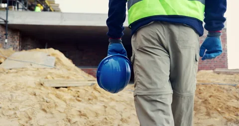 Construction, builder and hands with helmet, outdoor and protection for manual Vídeos de archivo 336779820