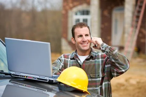 Construction: builder getting good news Stock Photos