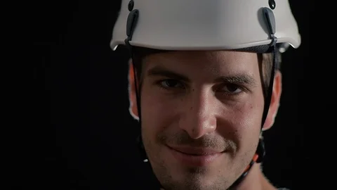 Construction builder with hard hat enter the frame with smiling face Stock Footage 107189227