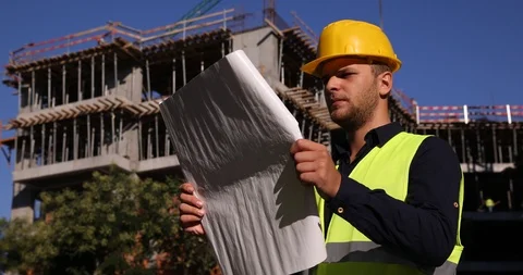 Construction Builder Man Looking Up at Construction Project Analyze Scheme Plan Vídeos de archivo 88007691