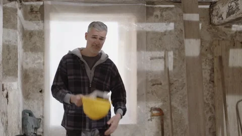 Construction builder worker on site wearing safety yellow helmet, tapping h.. Stock Footage 307843255