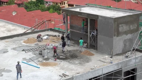 Construction builder workers mixing cement by hand Stock Footage 137937791