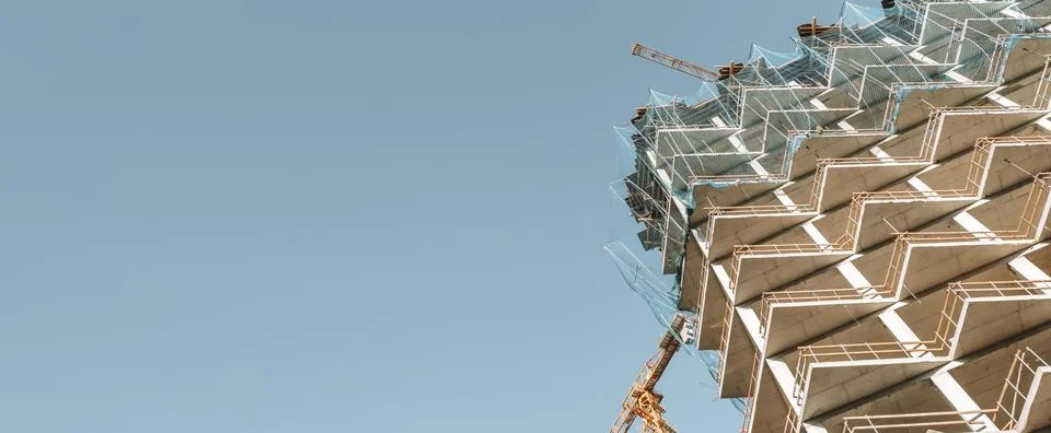 Construction of a building banner background. Construction site with crane Fotos de archivo