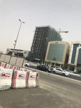 The construction building beside the highway Stock Photos