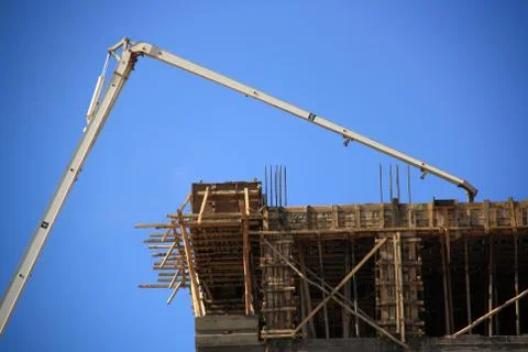 Construction of building with cement mixture machine Stock Photos