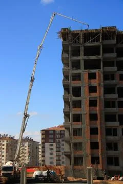 Construction of building with cement mixture machine Stock Photos