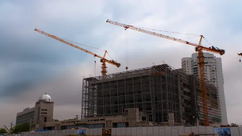 Construction of a building in the city, work of a crane Stock Footage 92200424