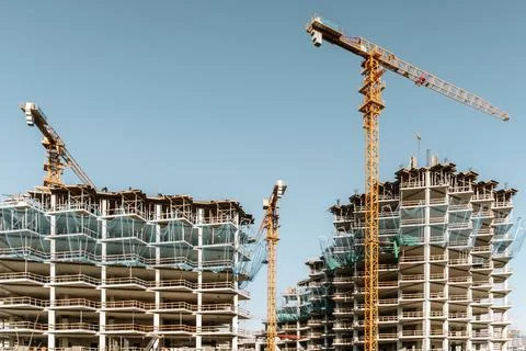 Construction of a building. Construction site with crane. Business, develop.. Stock Photos
