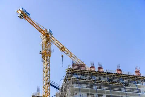 Construction of a building. Construction site with crane. Business, development 写真素材