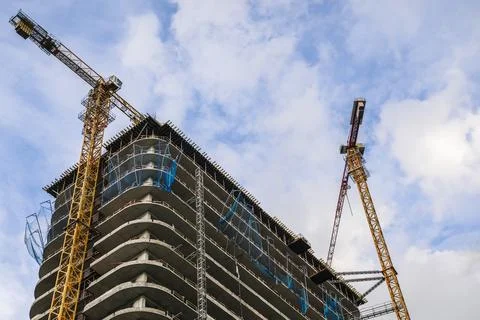 Construction of a building. Construction site with crane. Business, development Stock Photos