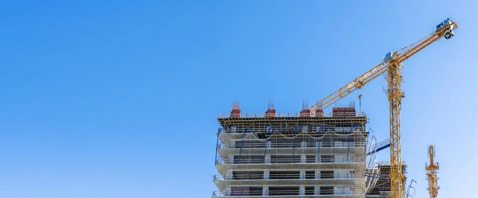Construction of a building. Construction site with crane. Business, development 写真素材