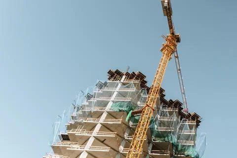 Construction of a building. Construction site with crane. Business, development 写真素材