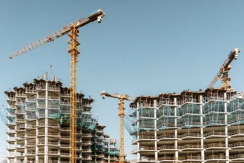 Construction of a building. Construction site with crane. Business, development 写真素材