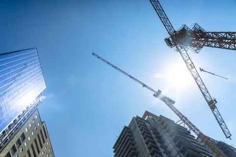 Construction of a building. Construction site with crane. Business, development Stock Photos