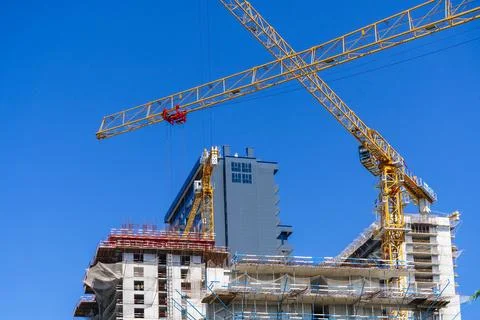 Construction of a building. Construction site with crane. Business, development Stock Photos