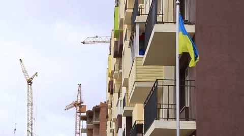 Construction. Building. Crane. Ukrainian flag. Stock Footage 53825147