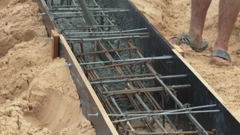 Construction of building foundation. Pouring with liquid concrete of formwork Stock Footage 159891763