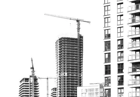 Construction building isolated on white background. Tall high rise tower with Stock Photos