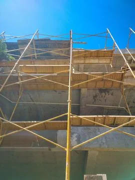 Construction of a building with scaffolding in front Stock Photos