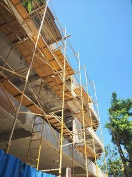 Construction of a building with scaffolding in front Stock Photos