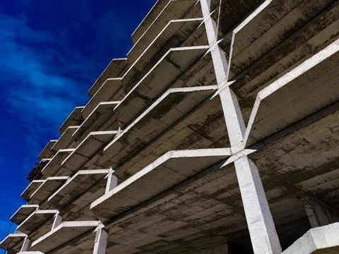 Construction of a building structure with concrete floors and beams in an urban Stock Photos